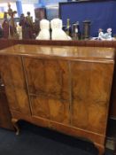 A walnut cocktail cabinet