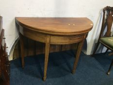 A demi-lune mahogany tea table