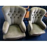 A pair of buttoned easy chairs