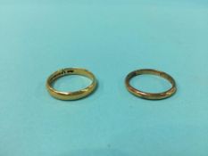 Two gold coloured rings, 6.9 grams