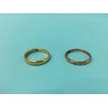 Two gold coloured rings, 6.9 grams