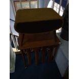 A teak nest of tables and a sewing box