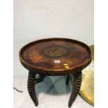 A carved top occasional table, on antelope horn legs