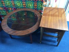 A glass top occasional table and a nest of tables