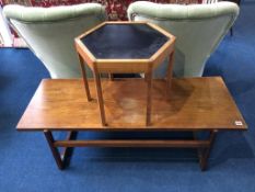 A teak coffee table and an occasional table