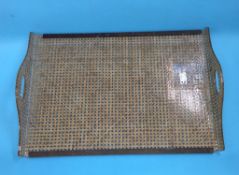 A Christian Dior lucite and rattan serving tray