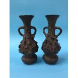 A pair of cast metal spill vases