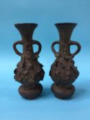 A pair of cast metal spill vases