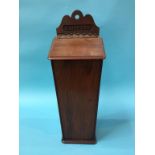 A mahogany slipper box