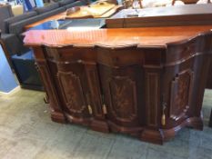 An Italian style serpentine sideboard