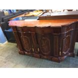 An Italian style serpentine sideboard