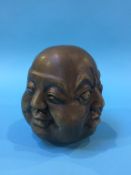 A four faced brass head