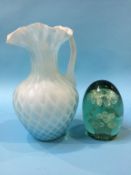 A carved glass jug and a glass dump