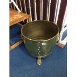 A brass bin, with lion mask handles