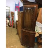 A mahogany corner cabinet