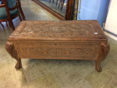 A heavily carved Middle Eastern blanket box