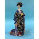 A Japanese figure of a Geisha