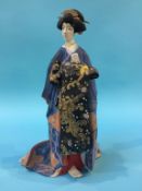 A Japanese figure of a Geisha