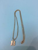 A 9ct gold chain and charm, 11 grams