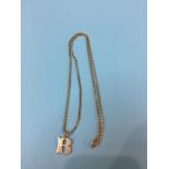 A 9ct gold chain and charm, 11 grams