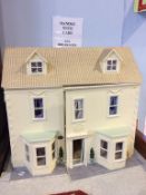 A dolls house and contents