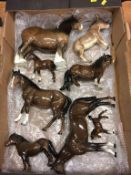 A collection of Beswick horses and donkeys