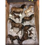 A collection of Beswick horses and donkeys