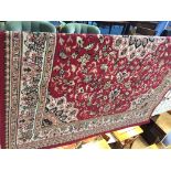 A red ground rug, 200cm x 290cm approx.
