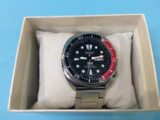 A Seiko x Padi Quartz divers watch and box