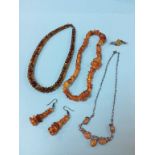 A collection of amber coloured beads and jewellery, 66 grams approx.