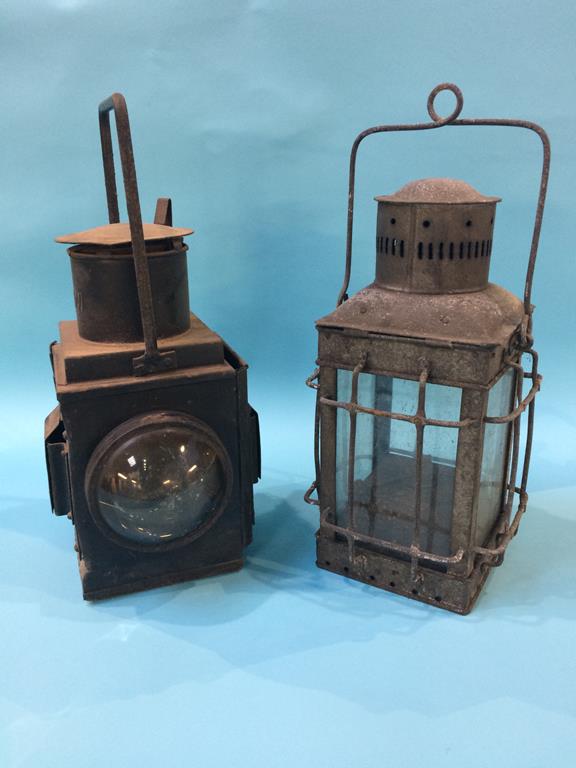 A railway lantern and one other