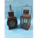 A railway lantern and one other
