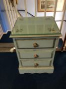 A painted bedside chest