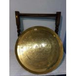 A brass top occasional table