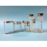 A pair of silver mounted spill vases and scent bottles etc.
