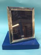 A large silver photo frame, 26cm wide x 31cm high