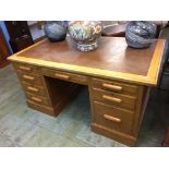 A 1930s oak pedestal desk. 151cm x 90cm