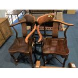 A pair of Oriental hardwood corner chairs, with solid seats
