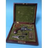 A reproduction walnut cased flintlock pistol and accessories