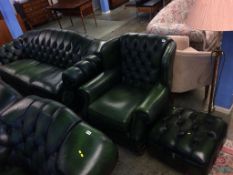 A green Chesterfield style three seater settee, armchair and footstool