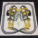 A black ground silk Hermes scarf