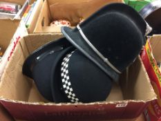 A quantity of police helmets / hats