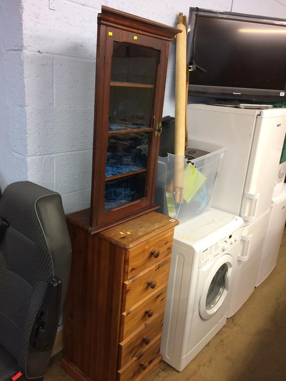 A pine narrow chest of drawers and a corner cabinet