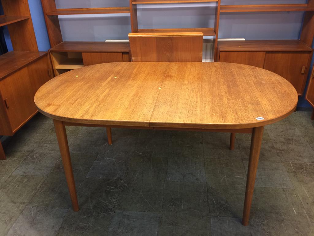 A teak dining table by Troeds , extending with two extra leaves. 285cm length, 100cm width
