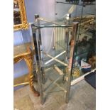 A chrome and glass three tier stand