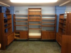A large five section teak display/wall units, with open shelves, cupboards and sliding glass