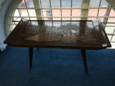 An Oriental carved coffee table