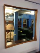 A teak framed mirror