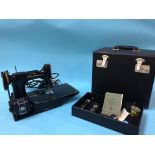 A Singer 221K cased sewing machine