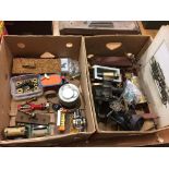 Two boxes of model engine parts